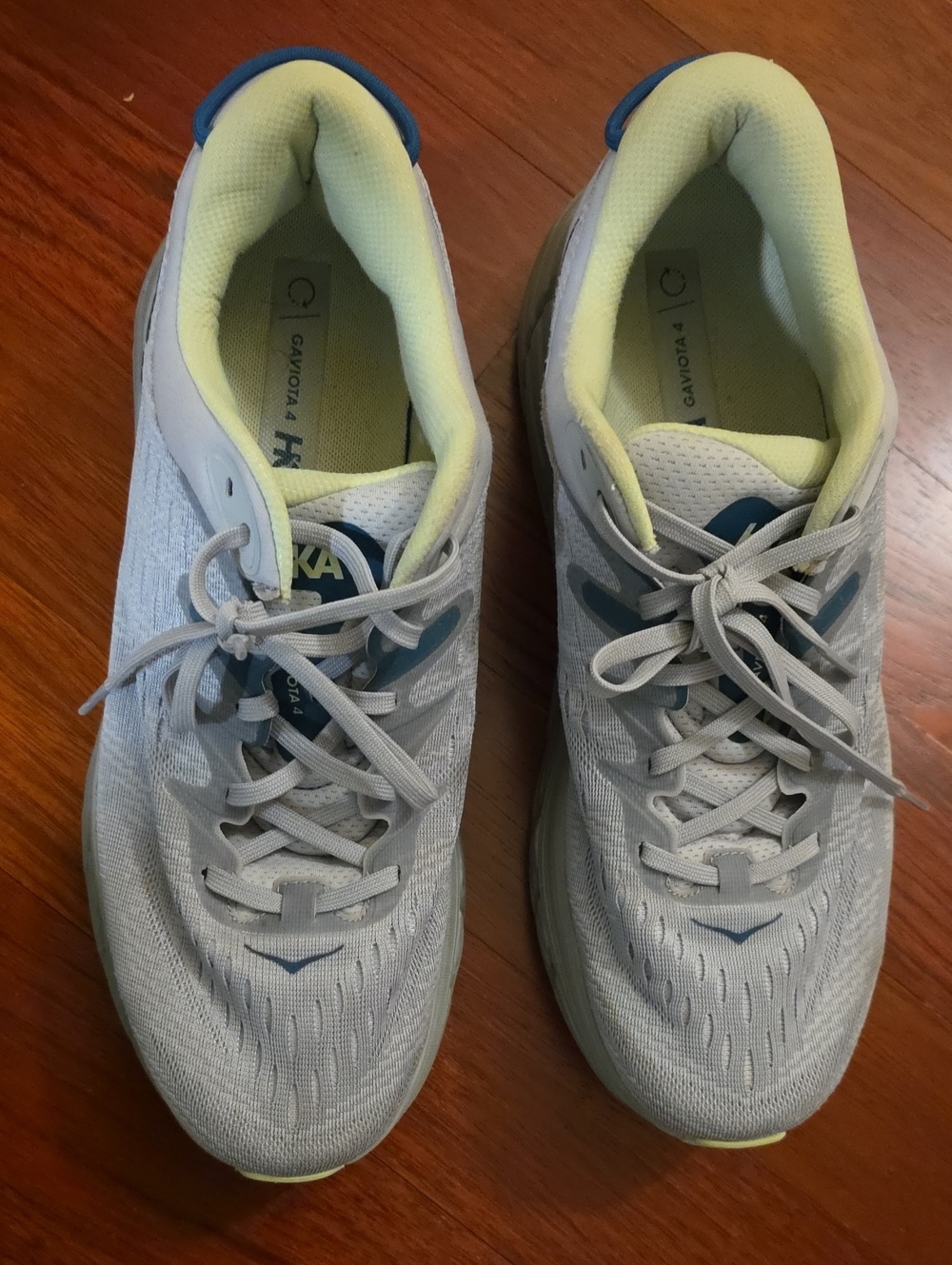 Hoka Men's Athletic Shoes in Light Gray with Blue and Pale Yellow Accents